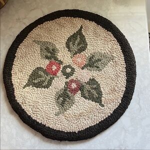 Vintage black and green Floral Hook Rug Chair Pad 14 1/2” in diameter.